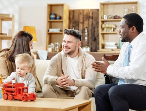 african-american-agent-talking-young-couple-with-kid-about-real-estate-mortgage_274679-8377